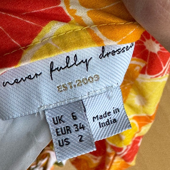 Never Fully Dressed - Picture 7 of 7